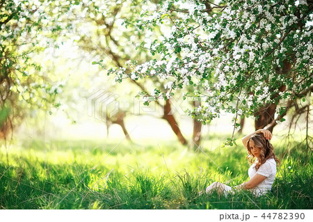 spring girl apple flowers, nature portrait of happy girl with long hair in blooming apple trees, freedom purity concept of happiness spring girl apple flowers, nature portrait of happy girl with long hair in blooming apple trees, freedom purity concept of happiness 44782390