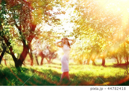spring girl apple flowers, nature portrait of happy girl with long hair in blooming apple trees, freedom purity concept of happiness spring girl apple flowers, nature portrait of happy girl with long hair in blooming apple trees, freedom purity concept of happiness 44782418