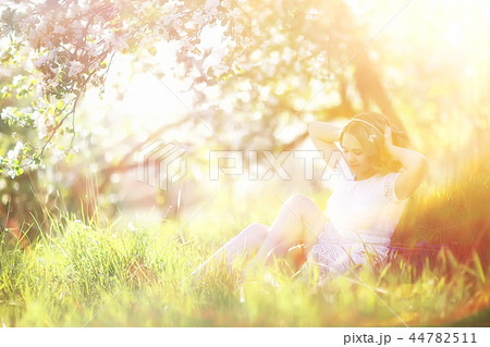 spring girl apple flowers, nature portrait of happy girl with long hair in blooming apple trees, freedom purity concept of happiness spring girl apple flowers, nature portrait of happy girl with long hair in blooming apple trees, freedom purity concept of happiness 44782511