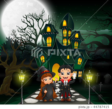 Happy halloween vampire and witch in front of the Happy halloween vampire and witch in front of the 44787415
