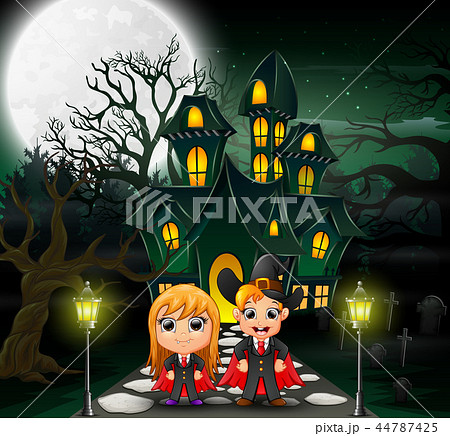 Happy couple vampire in front of the haunted house Happy couple vampire in front of the haunted house 44787425