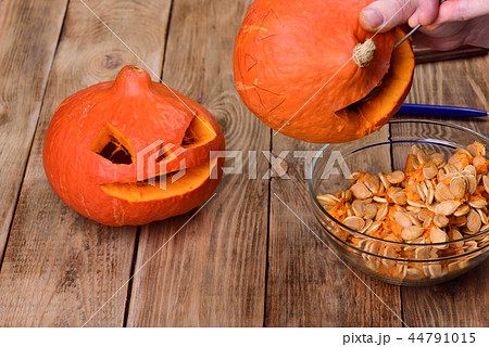 Scraping another pumpkin. Making a pumpkin lantern for Halloween 44791015
