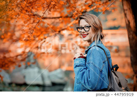 beautiful young girl in jacket in a park beautiful young girl in jacket in a park 44795919