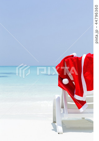 Santa Claus wear hanging on sun lounger 44796360