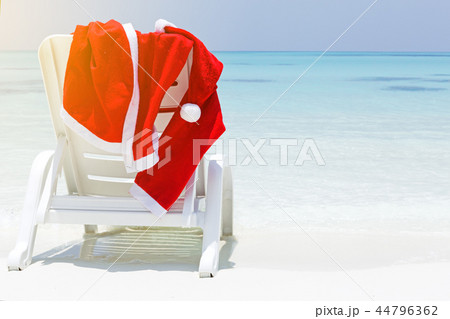 Santa Claus wear hanging on sun lounger 44796362