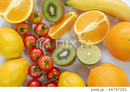 Various sliced fruits on white background Various sliced fruits on white background 44797202