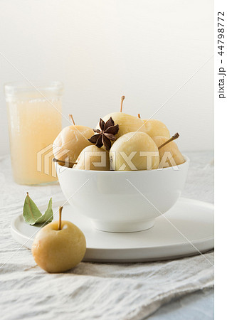 Pickled apples in bowl and apple sidr on white. 44798772