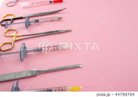 Flat lay of medical instruments on rose background. Mock up health care medical background. Flat lay of medical instruments on rose background. Mock up health care medical background. 44799704