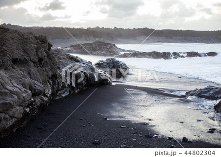 Black sand beach in Lanzarote on sunset. Black sand beach in Lanzarote on sunset. 44802304