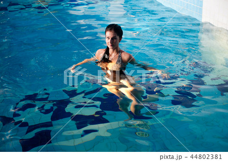 Attractive girl in swimming pool Attractive girl in swimming pool 44802381