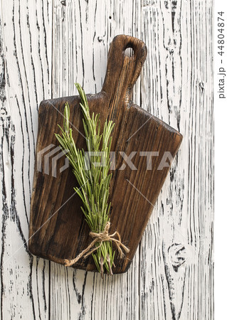 Cutting Board, rosemary and spices. Cutting Board, rosemary and spices. 44804874