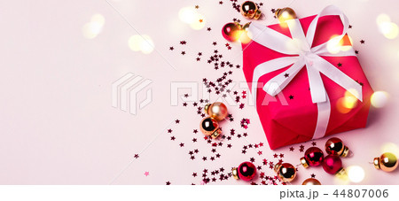 Christmas Red Gift Box on Pastel Background. Long banner format Christmas Red Gift Box on Pastel Background. Long banner format 44807006