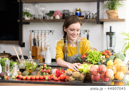 Woman with fruits and vegetables 44807043