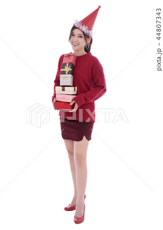 happy woman with hat and holding a christmas gift box isolated o happy woman with hat and holding a christmas gift box isolated o 44807343