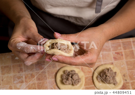 A woman is making pies A woman is making pies 44809451