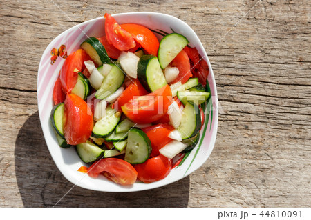 Fresh vegetable salad  with tomatoes, cucumbers 44810091