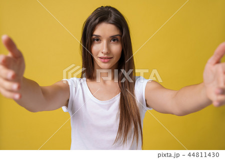 Pleasant attractive girl making selfie in studio and laughing. Good-looking young woman with brown 44811430