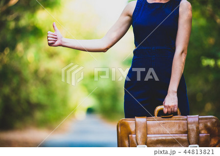 young woman with suitcase 44813821