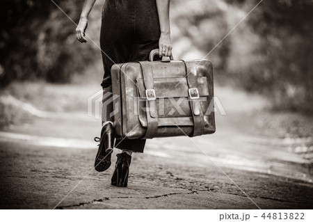 young woman with suitcase young woman with suitcase 44813822