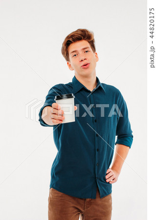 young man holding coffee on white background young man holding coffee on white background 44820175