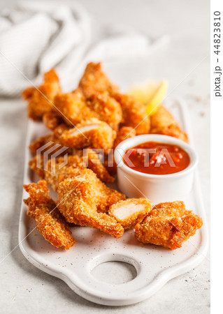 Fried Breaded chicken with tomato sauce Fried Breaded chicken with tomato sauce 44823810