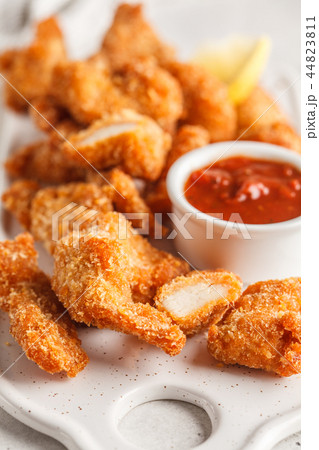 Fried Breaded chicken with tomato sauce Fried Breaded chicken with tomato sauce 44823811