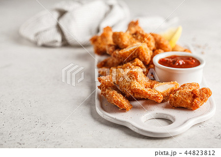 Fried Breaded chicken with tomato sauce Fried Breaded chicken with tomato sauce 44823812