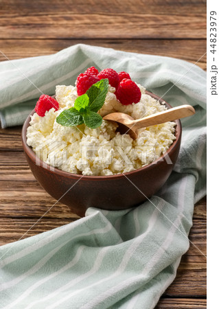 Fresh cottage cheese with raspberries  44823979