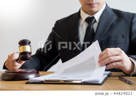 tribunal Attorney lawyer working with documents and wooden gavel tribunal Attorney lawyer working with documents and wooden gavel 44824022