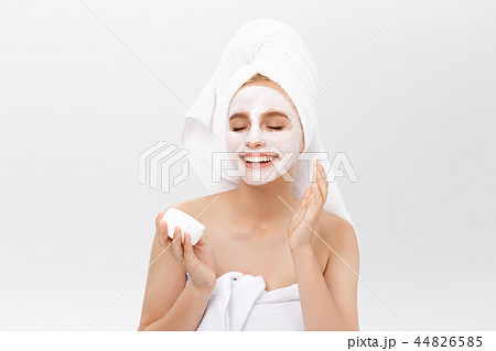 Beautiful woman with facial mask on white background 44826585