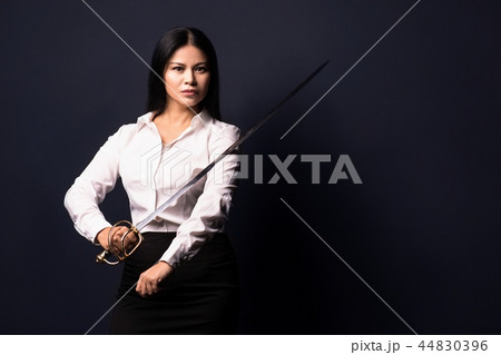 asian businesswoman with sword 44830396