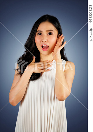 Young woman with shocked face 44830823