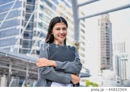 Business concept. Beautiful young businesswoman is working outdo Business concept. Beautiful young businesswoman is working outdo 44832504