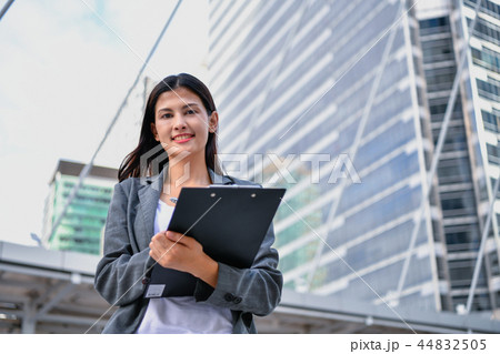 Business concept. Beautiful young businesswoman is working outdo 44832505