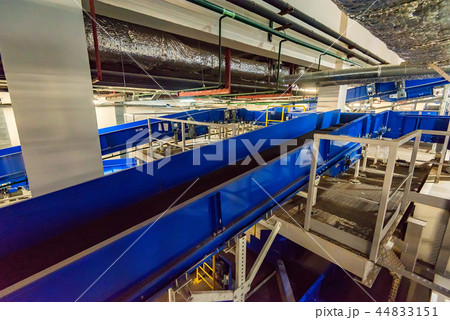 Baggage claim area with empty baggage carousels 44833151