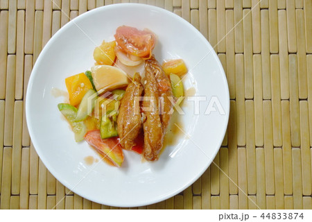 deep fried fish in sweet and sour gravy sauce deep fried fish in sweet and sour gravy sauce 44833874