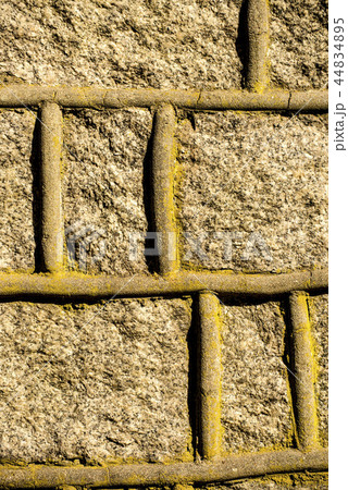 wall of rough stones with ornament 44834895