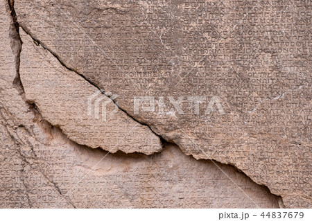 ancient Greek writing chiseled on stone ancient Greek writing chiseled on stone 44837679