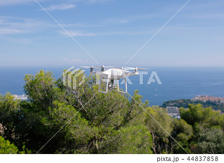 Drone, flying against the blue sky quadrocopter fpv fly camera rc controller 44837858