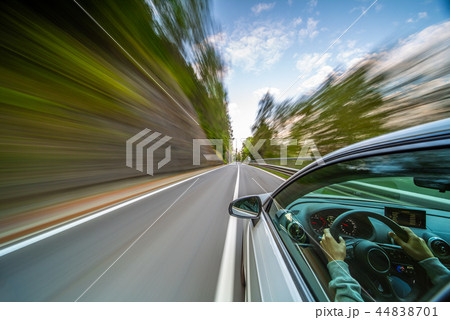 Car in motion blur driving in the Mountains Car in motion blur driving in the Mountains 44838701