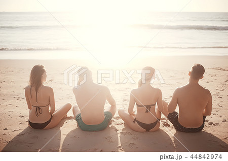 meditation and yoga on the beach / summer vacation concept health beauty, summer vacation yoga classes on the sea shore meditation and yoga on the beach / summer vacation concept health beauty, summer vacation yoga classes on the sea shore 44842974