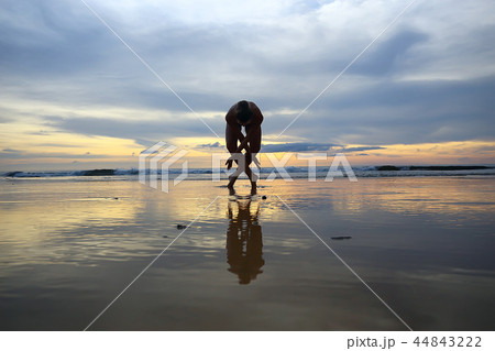 meditation and yoga on the beach / summer vacation concept health beauty, summer vacation yoga classes on the sea shore 44843222