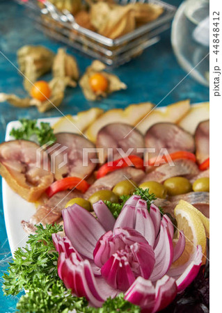Plate with fish platter on blue background Plate with fish platter on blue background 44848412
