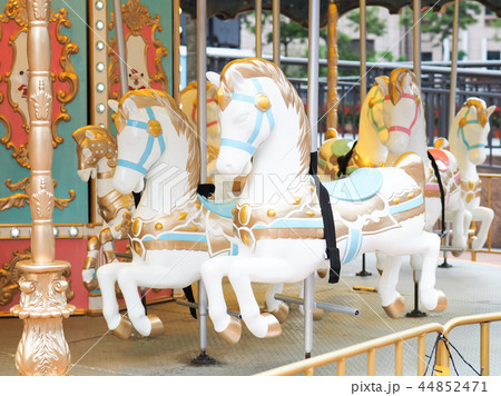 Horses on a carnival Merry Go Round 44852471