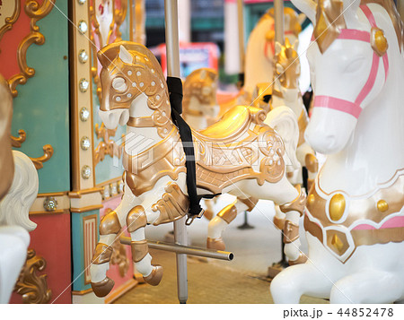 Horses on a carnival Merry Go Round 44852478
