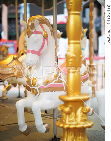 Horses on a carnival Merry Go Round 44852483