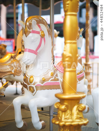 Horses on a carnival Merry Go Round 44852484