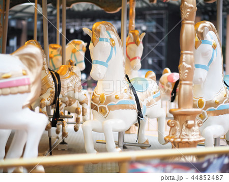 Horses on a carnival Merry Go Round 44852487
