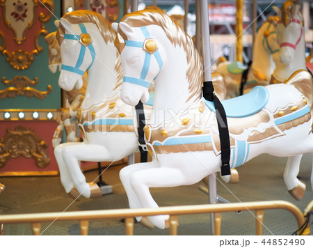 Horses on a carnival Merry Go Round 44852490