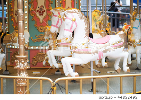 Horses on a carnival Merry Go Round 44852495